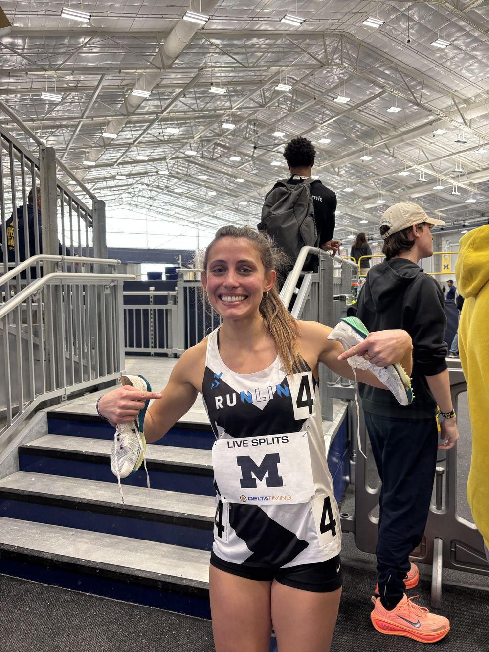 A smiling Runline athlete after an indoor race