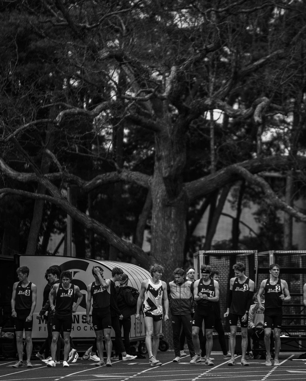 A Runline athlete on the start line among a field of university runners